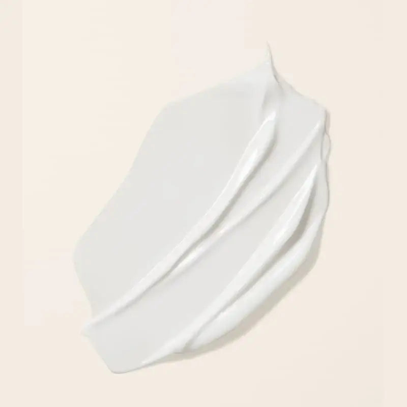Smooth white curl cream swatch for defining and moisturizing curly hair