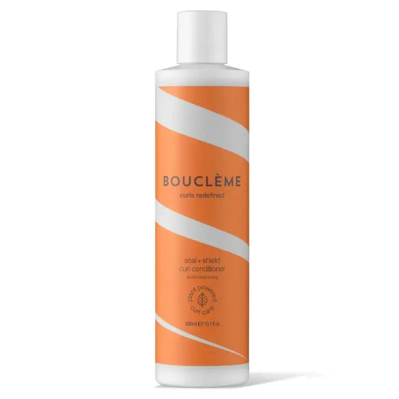 Bouclème Seal + Shield Curl Conditioner for defined, healthy curls – plant-powered formula in orange bottle