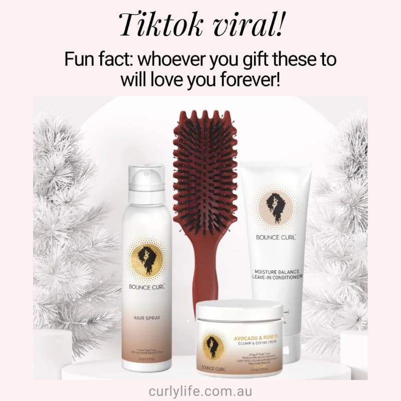 Bounce Curl hair spray, leave-in conditioner, clump & define cream, and detangling brush for curly hair care